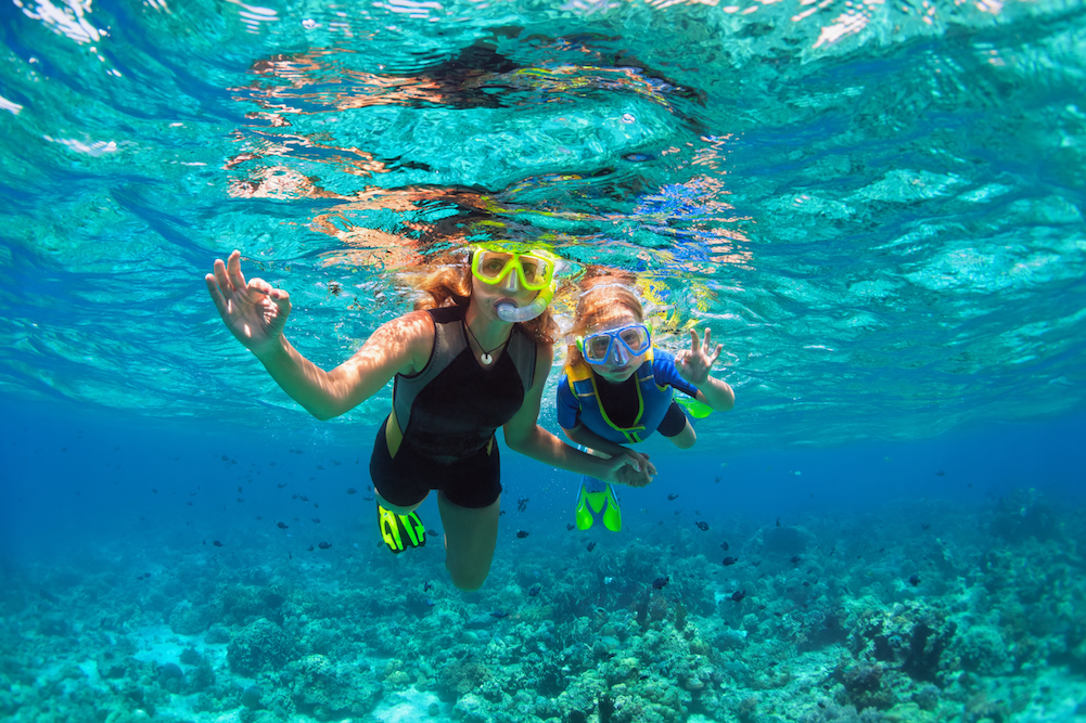 mother and daughter snorkeling